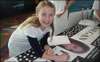 A Tweenangel from the Danville Chapter Signing a Megan Pledge Banner