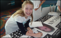 Photograph: A Tweenangel Signing a Megan Pledge Banner